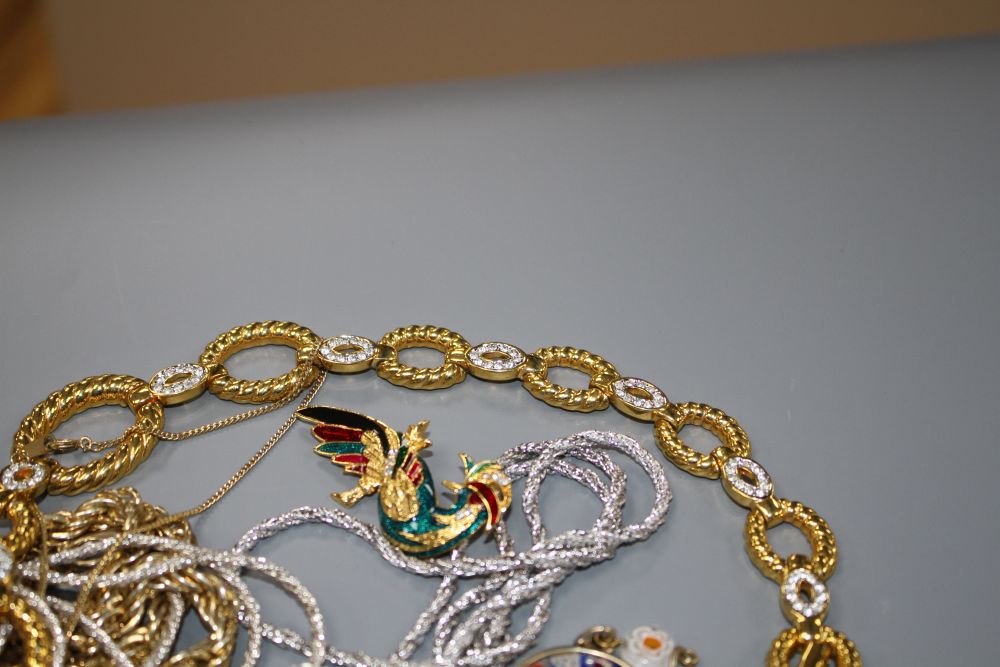 Seven assorted costume necklaces including a millefiore glass necklace, a costume bird brooch and bracelet with coloured paste stone